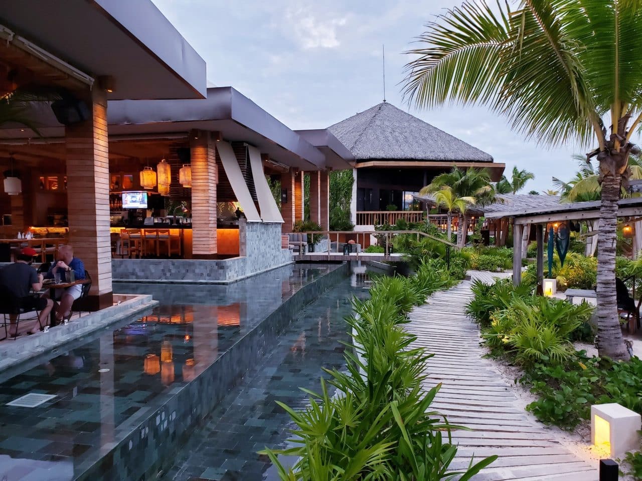 landscaping of outdoor space in luxury style with terrace and water features